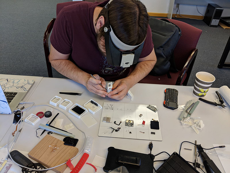 Dmitry Parshkov working with an engineering prototype in his San Diego laboratory